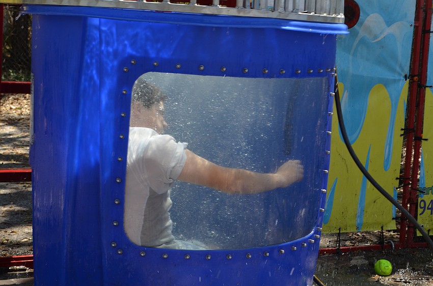 Bryce Berkowitz splashes into the dunk tank after a pitch.