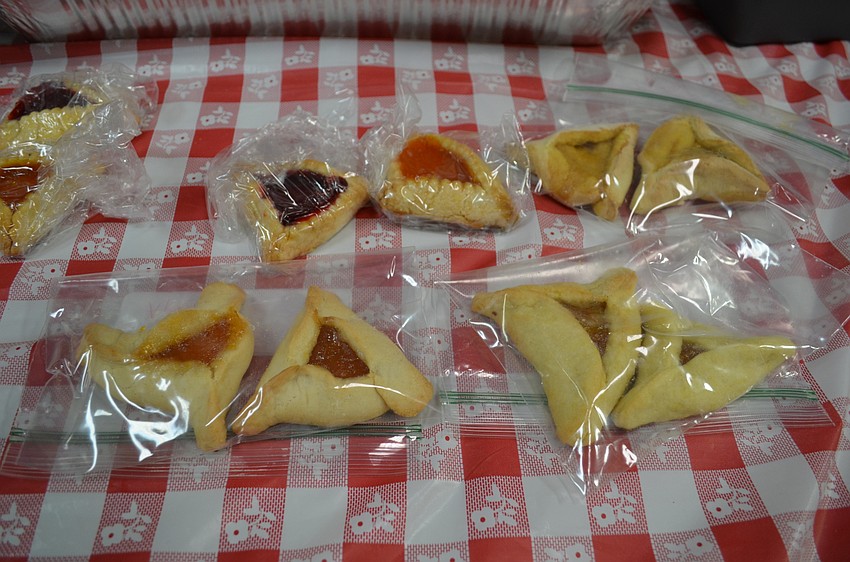 Hamantaschen cookies are the traditional treat to celebrate Purim. Some of the different filling flavors included chocolate, apricot, raspberry and butterscotch.
