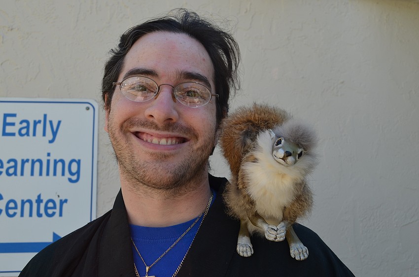 Temple Emanu-El teacher Lou Glucho's costume included the lifelike puppet squirrel Mortimer.