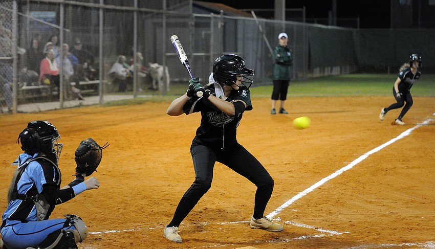 Lakewood Ranch Mackenzie Meyer looks to drive in Denali Schappacher in the first inning.
