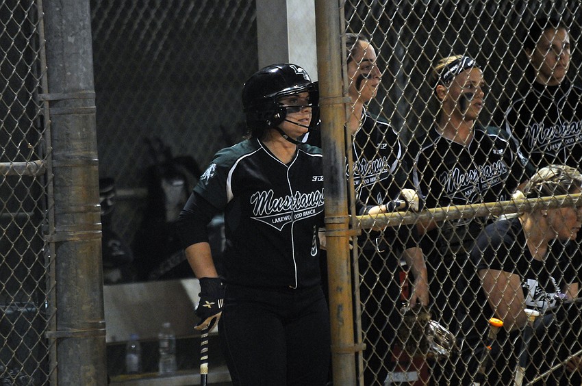 Maddie Biggs, Logan Newton, Kinsey Goelz and Kyra Klarkowski look on from the dugout during Lakewood Ranch's game versus Lake Region March 4.