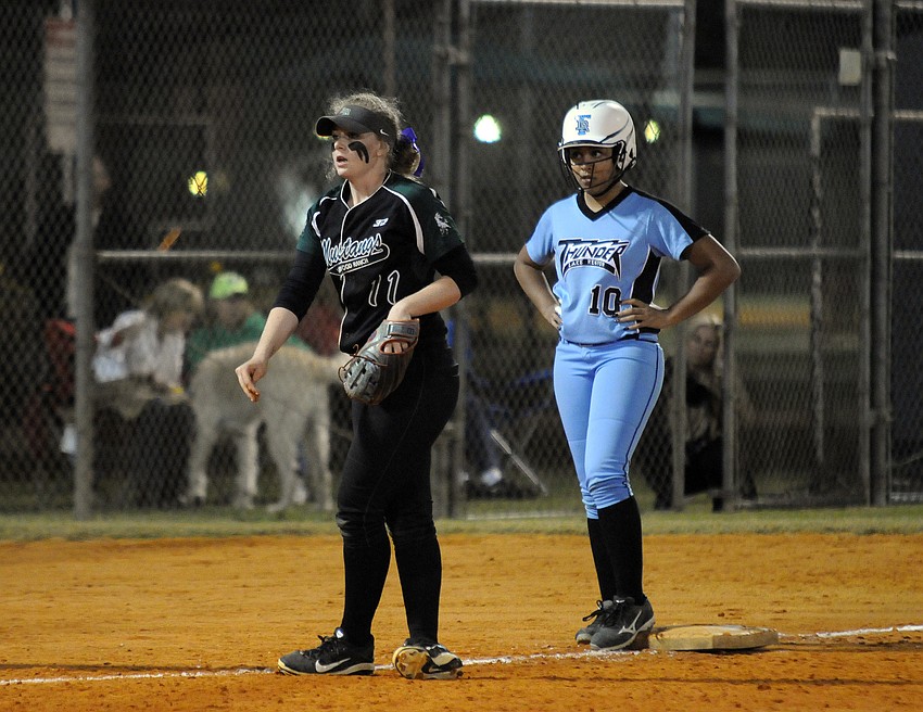 Lakewood Ranch sophomore Morgan Cummins holds Lake Region's Kaylee Johnson on third base.