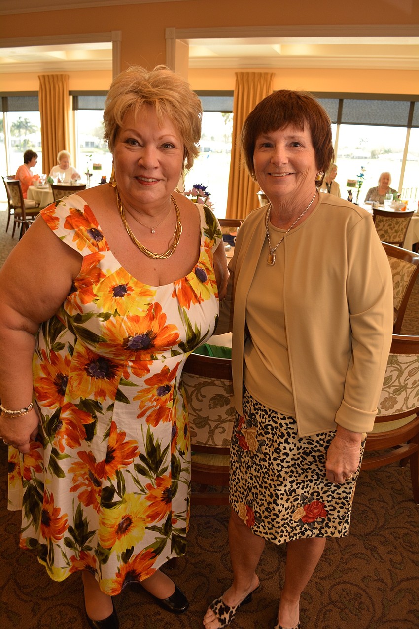 Pat Babcock and Kristine Erickson sell raffle tickets.