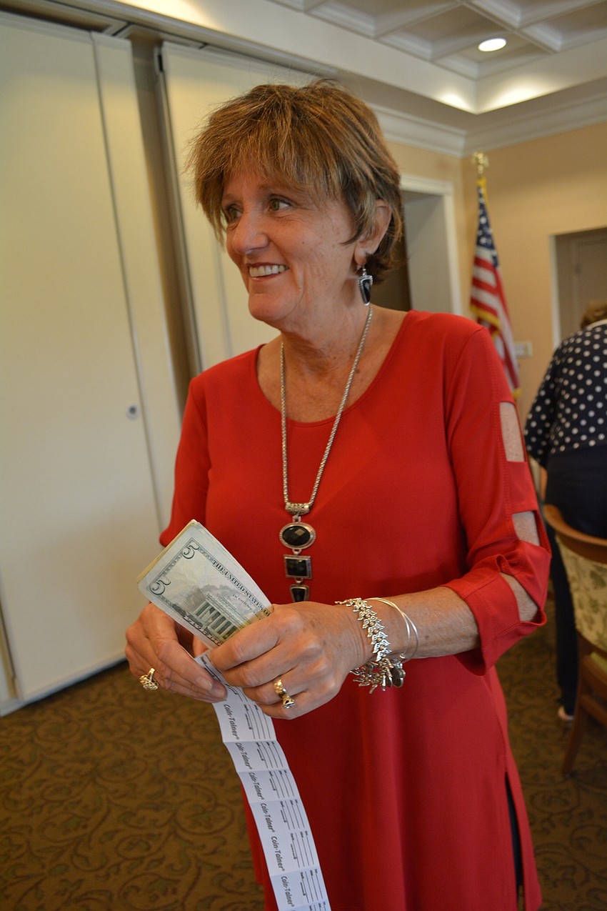 Jane O'Tain sells raffle tickets.