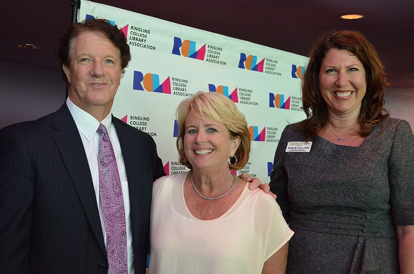 Presenting Sponsors from Tidewell Gerry Radford and Denise Pope with Ringling College Library Association Board President Renee Eppard (center).