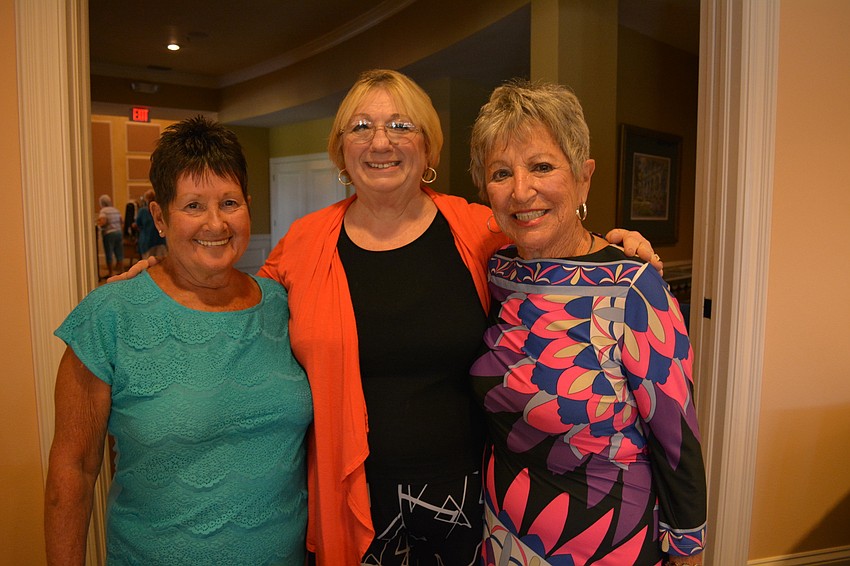 Donna Breeden, Kathy Eubanks and Barbara White direct guests to their tables.