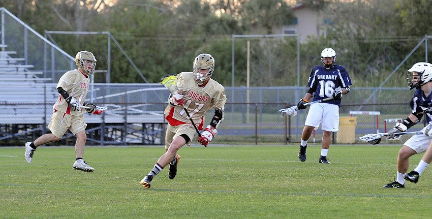 Cardinal Mooney freshman Sam Koscho races up the field.