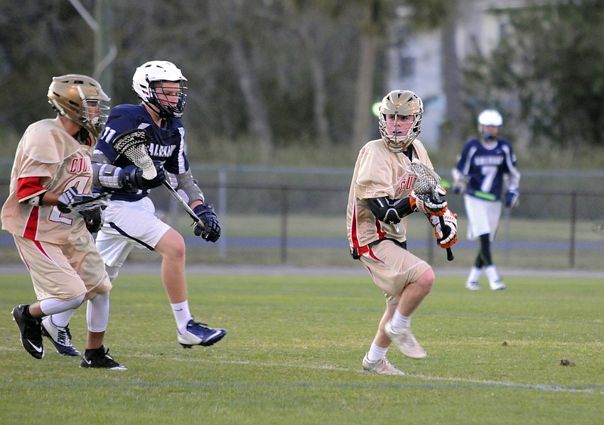 Cardinal Mooney freshman Connor Nicholson looks for an open teammate.