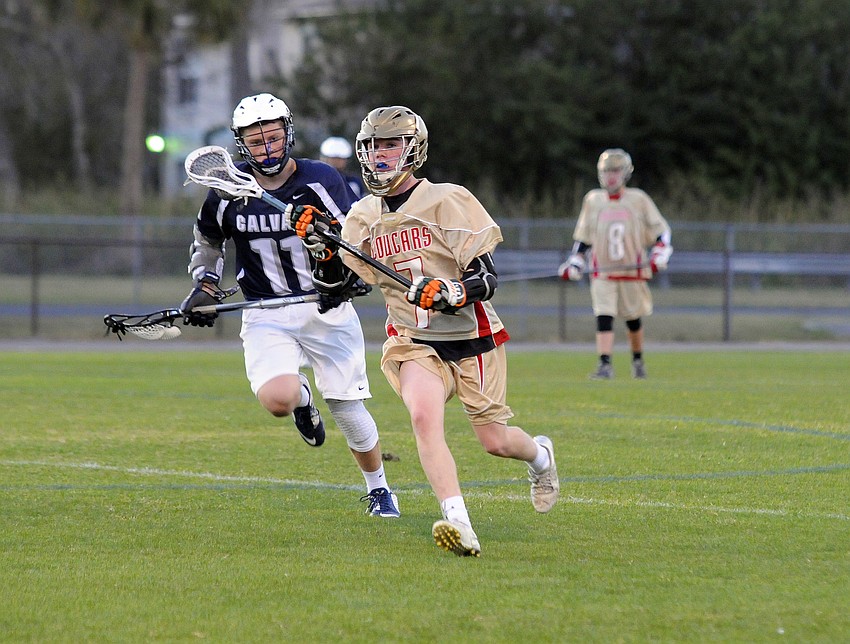 Cardinal Mooney freshman Connor Nicholson looks for an open teammate.