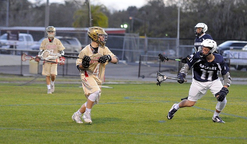 Cardinal Mooney sophomore Forrest Harris prepares to pass the ball.