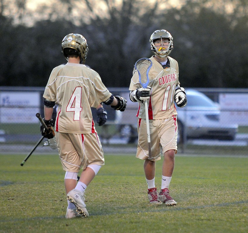 Forrest Harris congratulates Patrick Kenefick following Kenefick's goal.