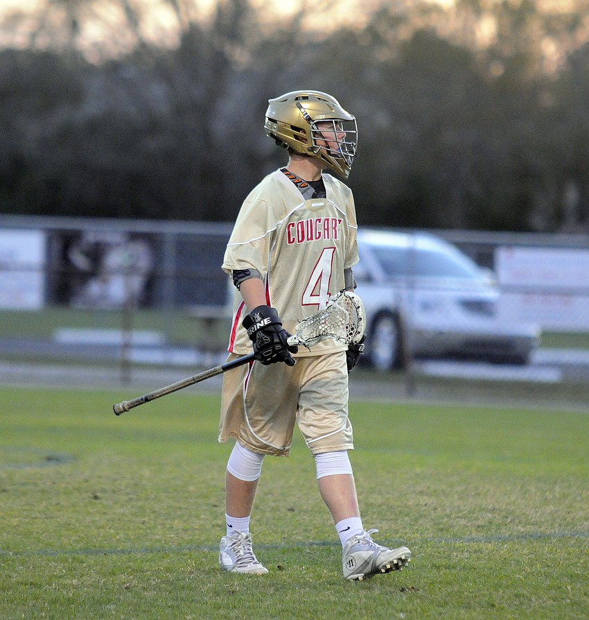 Forrest Harris is one of eight sophomores on Cardinal Mooney's JV lacrosse team.