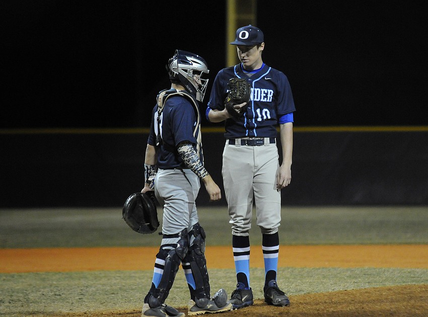 ODA catcher Parke Phillips talks with pitcher Nicholas Saranczak in the first inning.