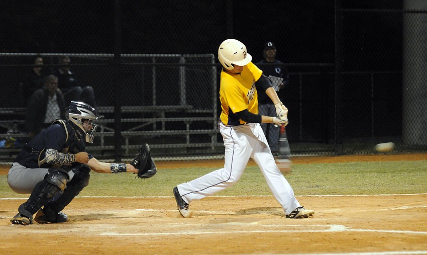 Booker junior Alex Amero makes contact in his first at bat.