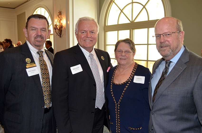 Michael Ayres and Dennis Stover with Linda and Charles Baumann