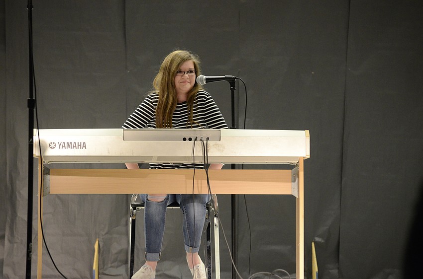 Colleen Gilbride sings and plays to 