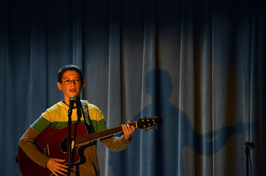 Ethan Nicholls plays and sings 