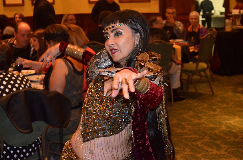 Marguerite Barnett and Bob the boa dance around the ballroom.