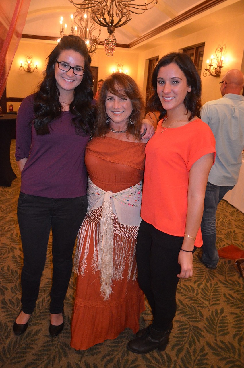 Jordyn Kroboth, Jaymie Klauber and Jaclyn Azcui chat with friends before finding a seat for dinner.