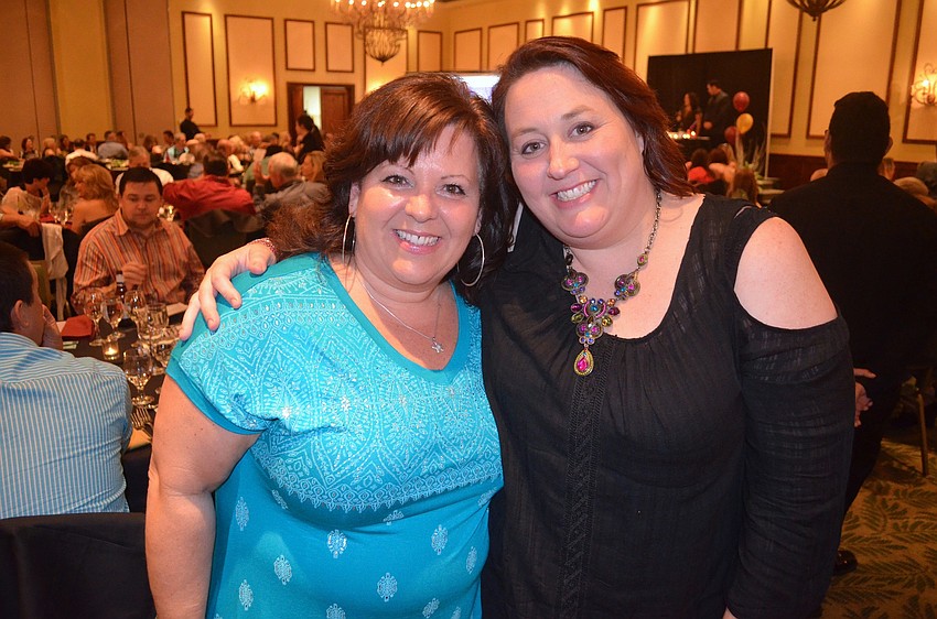 Jackie Riordan and Rhiannon Blaney, of the YMCA, show off matching smiles.