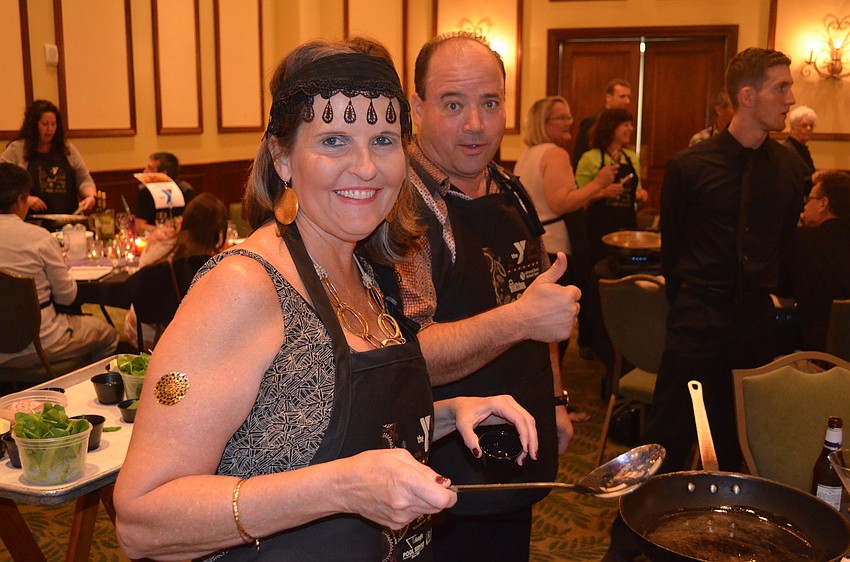 Linda Forrest dresses for the occasion as she cooks beside Paul Emory.
