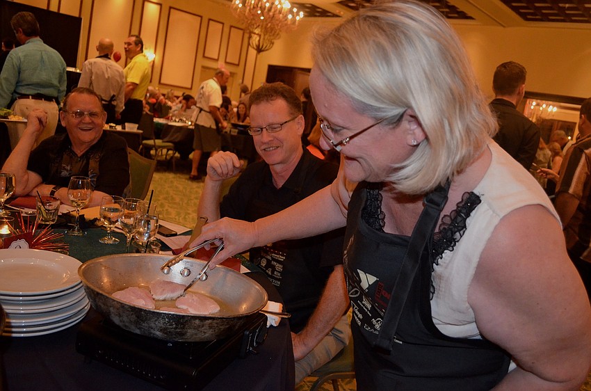 Lisa Ardis flips her fish.