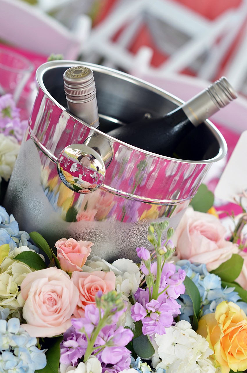 Fresh flowers surrounded champagne buckets on the tables at Pique Nique