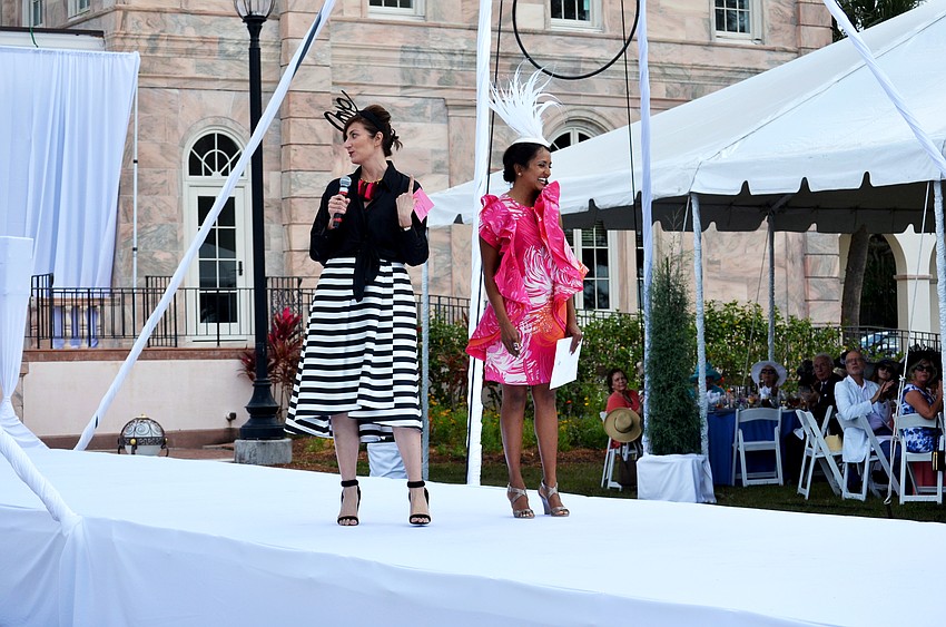 Heather Dunhill presenting Umbreen Khalidi-Majeed with the 'Best Hat' award