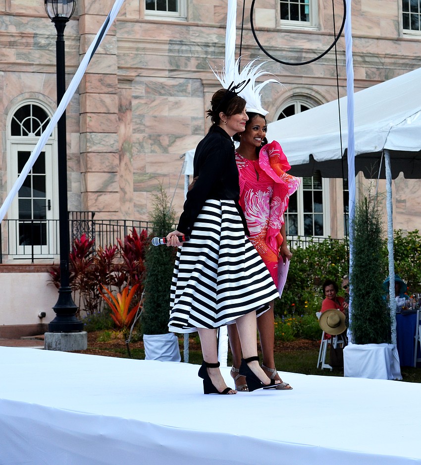 Heather Dunhill presenting Umbreen Khalidi-Majeed with the 'Best Hat' award