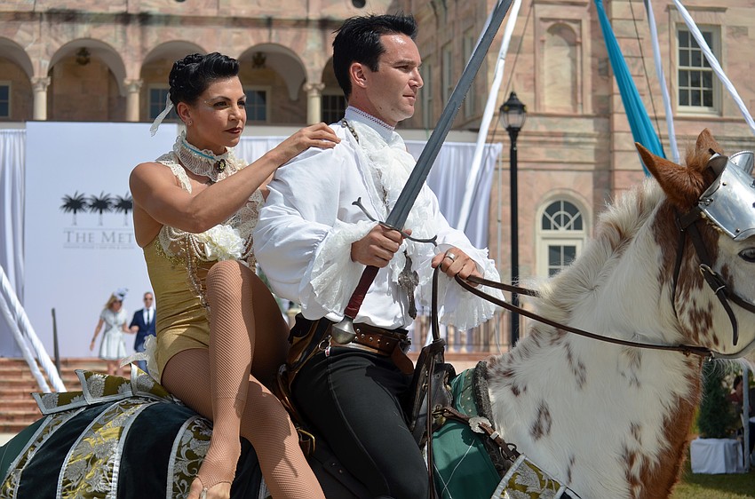Aerial artists rode in on horses before performing during the fashion show.