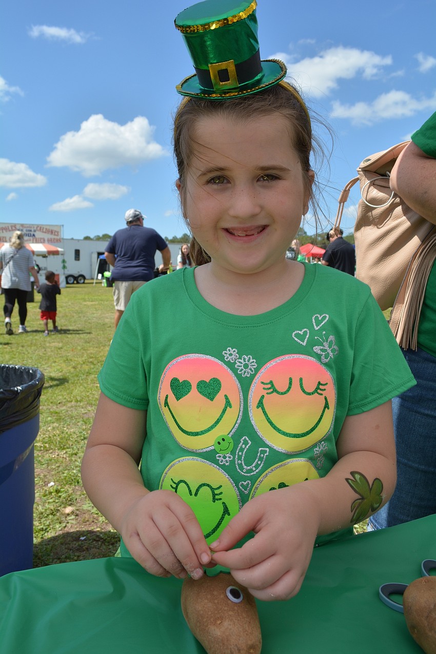 Lakewood Ranch's Erin Griffith, who turns 8 on March 18, adds a shamrock to her potato face.