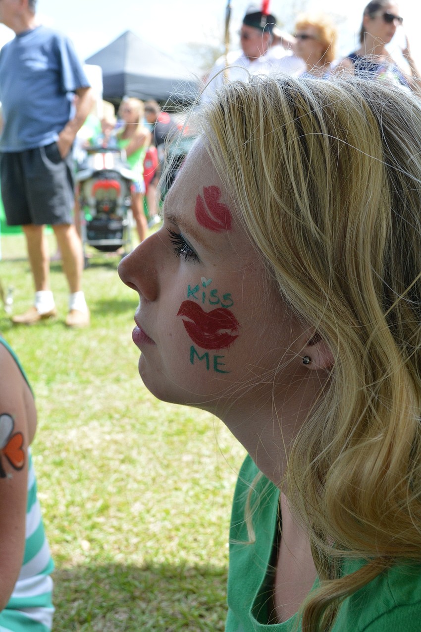 Sarasota High School's Kacey Wagner, 14, watches Irish dancers perform.