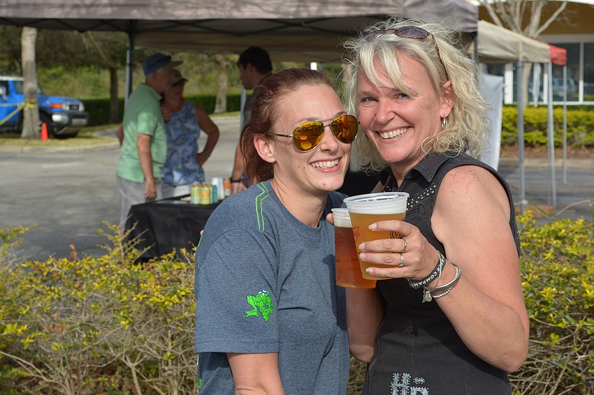 Jaimi Filkins shares a laugh with her mom, Susan Filkins. The Port Charlotte residents came to Heroes at the Ranch to enjoy the music.