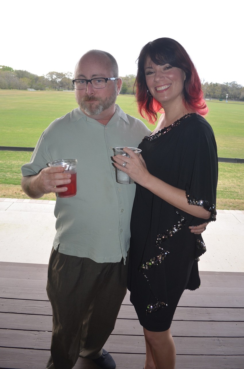 Chad Ketchum and Jennifer Duncan, of Miles, wait for dinner to be served.