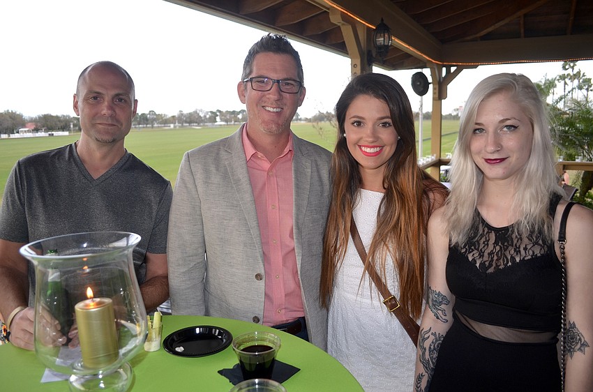 Mike Gerard, Scott Qurollo, Katie Kupser and Becca Merritt, of Pearl Brands, enjoy drinks and talking with friends.