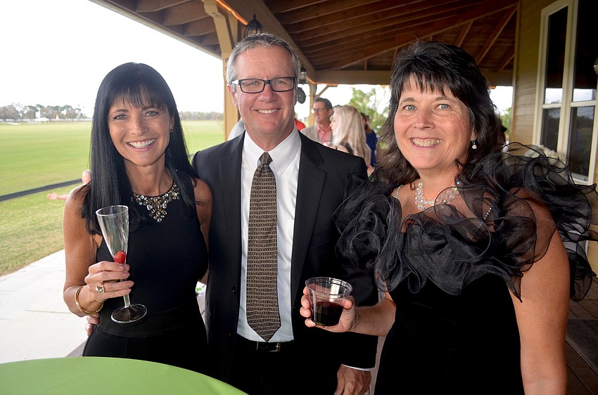 Cara Klein, Mike Scalcucci and Laurel Bookhardt, of Ringling College of Art & Design, toast a fun evening.