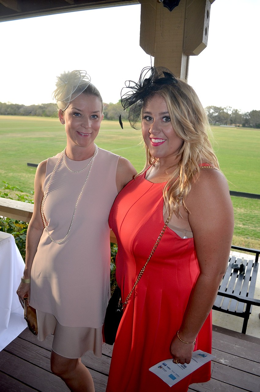Nicola Lutgert and Brianna White, or Premier Sotheby's International Realty, embrace the event's polo venue, with decorative headbands.