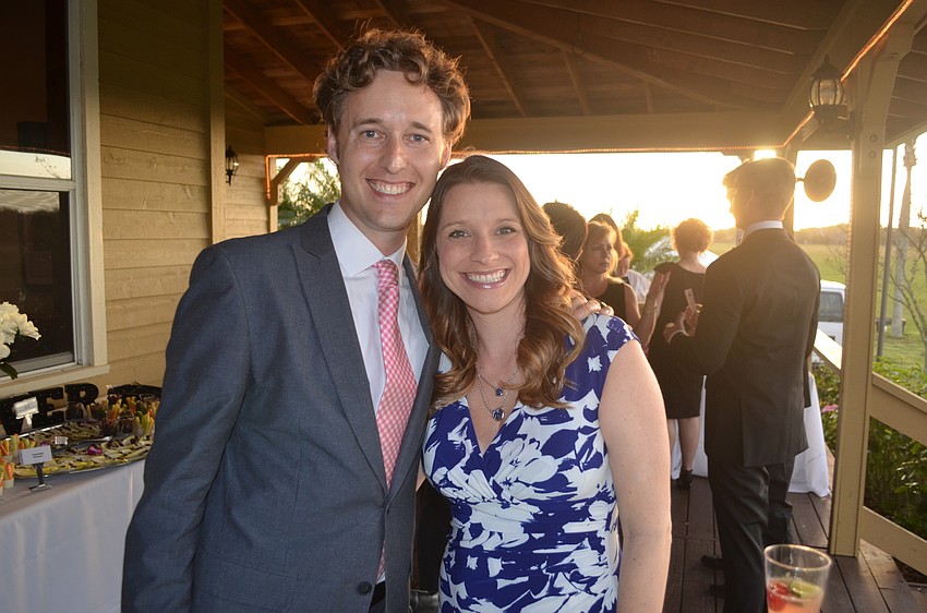 Brad Brian, of Brad Brian Multimedia, and Vivian Owen, of the Ringling College of Art & Design, wish each other luck.
