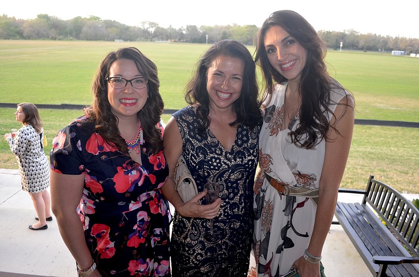 Lindsey Nickel and Kay Mathers support their friend, Megan Greenberg, of At Large Inc..