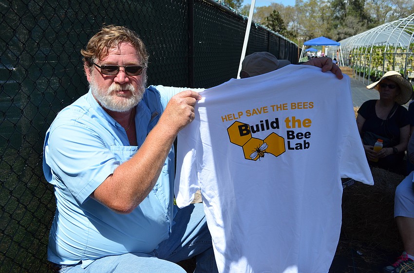 Bob Kinney with a shirt to help bring awareness to save the bees.