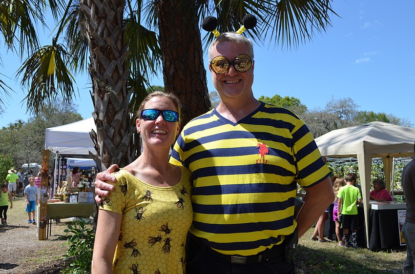 Missy and John Bekemeyer made sure to blend in with their bee-themed surroundings.