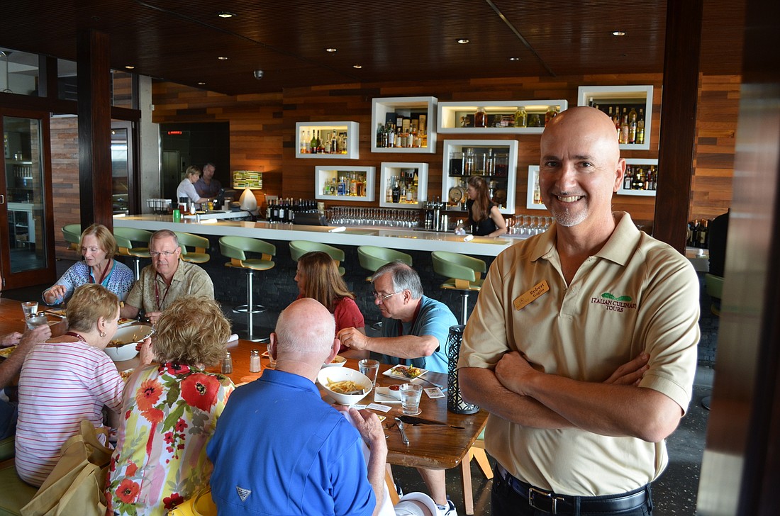 Robert Gaglio guides a tour, as guests eat at their first stop, Shore.