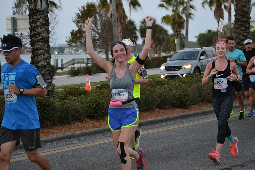 Rachel Liscia waves to her sister Sarah Liscia as she comes off the John Ringling Bridge.