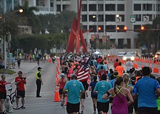 Runners make their way down the John Ringling Bridge.