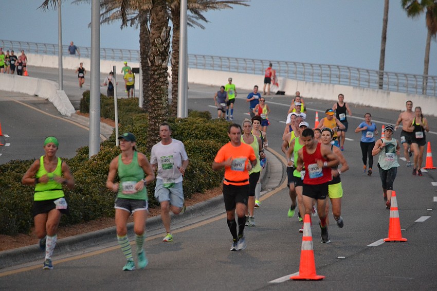 Runners make their way down the John Ringling Bridge.