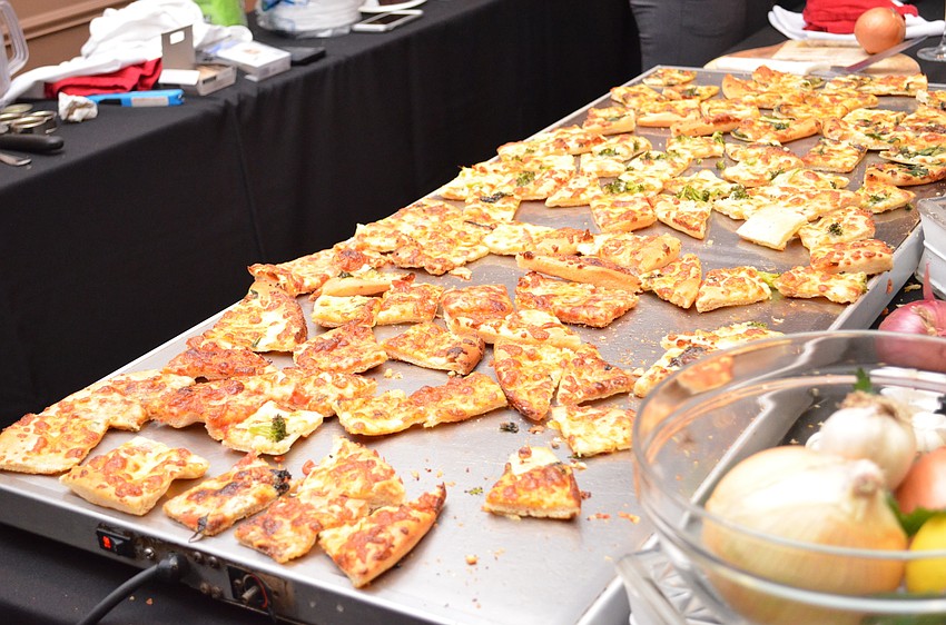 Savory offerings like slices of cheesy pizza from Pizza SRQ helped balance out the sweet treats.
