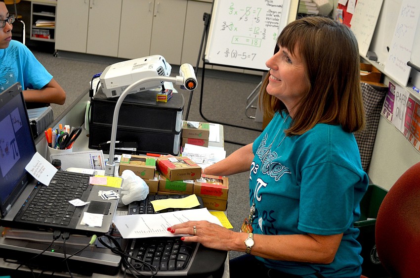 Eighth-grade math teacher Wendy Pittman leads a just-for-fun activity on words that include the word 