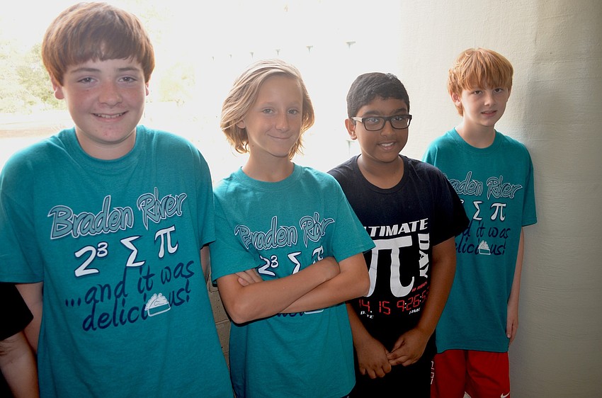 Braden River students Andrew Landers, Brecken Fair, Christopher Bowers and Imran Sandhu show off their Pi Day shirts.
