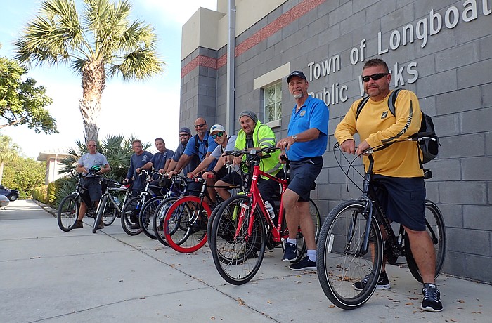 Longboat Key Public Works employees Mark Kerr, Dale Wyman, Frank Scrivani, Jason Schmidt,  Mark Richardson, Troy Wooten, Brad Sicard, James Linkogle and Tony Porter get ready to ride.