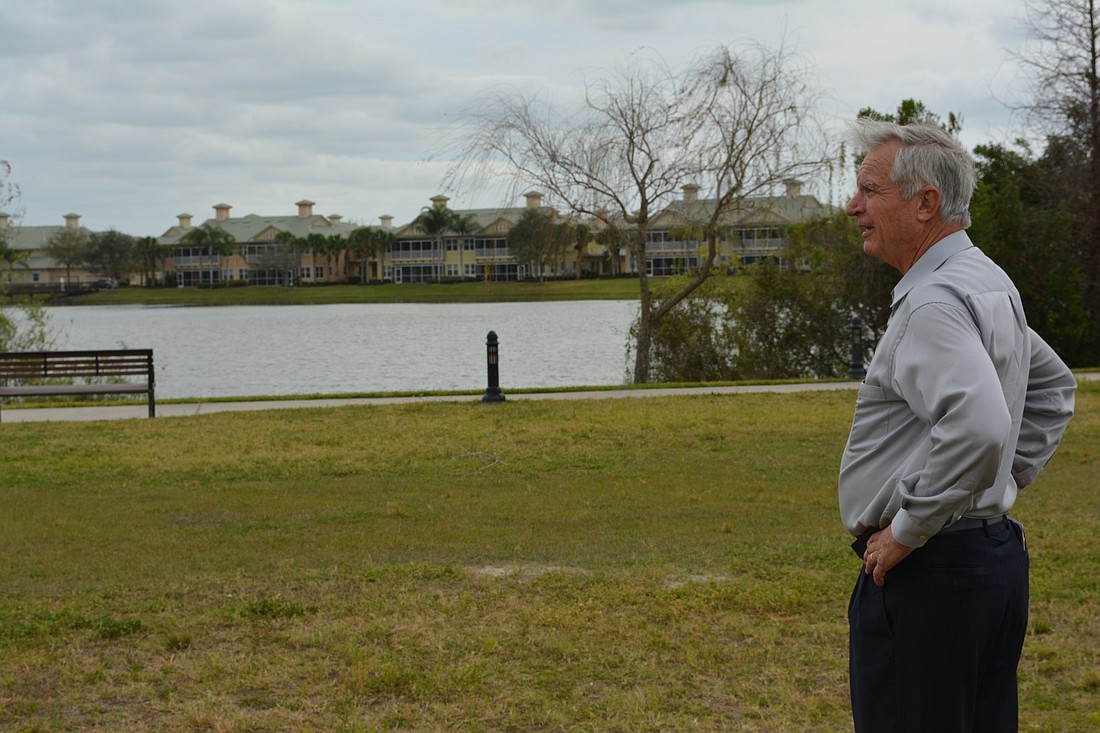 Project manager John Swart looks over the site of The Lakeshore project, expected to break ground in June.